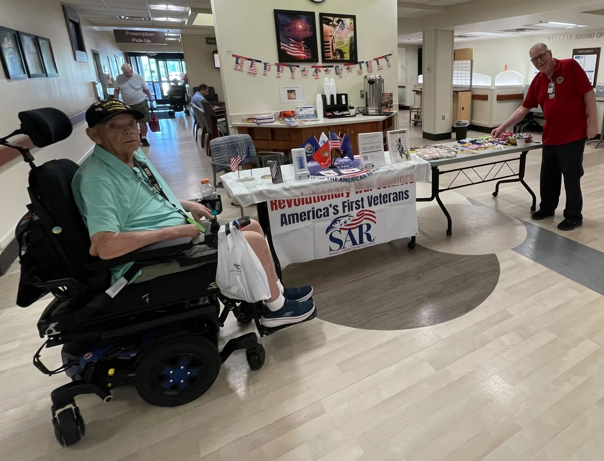 Chapter members serving coffee and donuts to patients at the Fort Wayne VA Hospital
